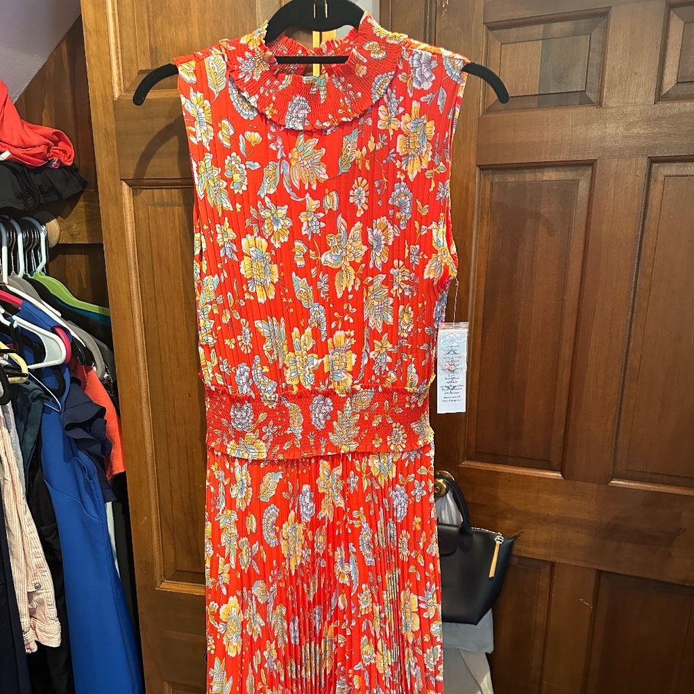 Red, Floral Sleeveless dress with mock collar and button back.  Pleated Skirt.